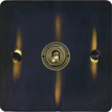 flat aged brass intermediate toggle switch (1 gang) front fc0825