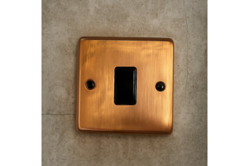 Tarnished Copper Switch on a concrete background